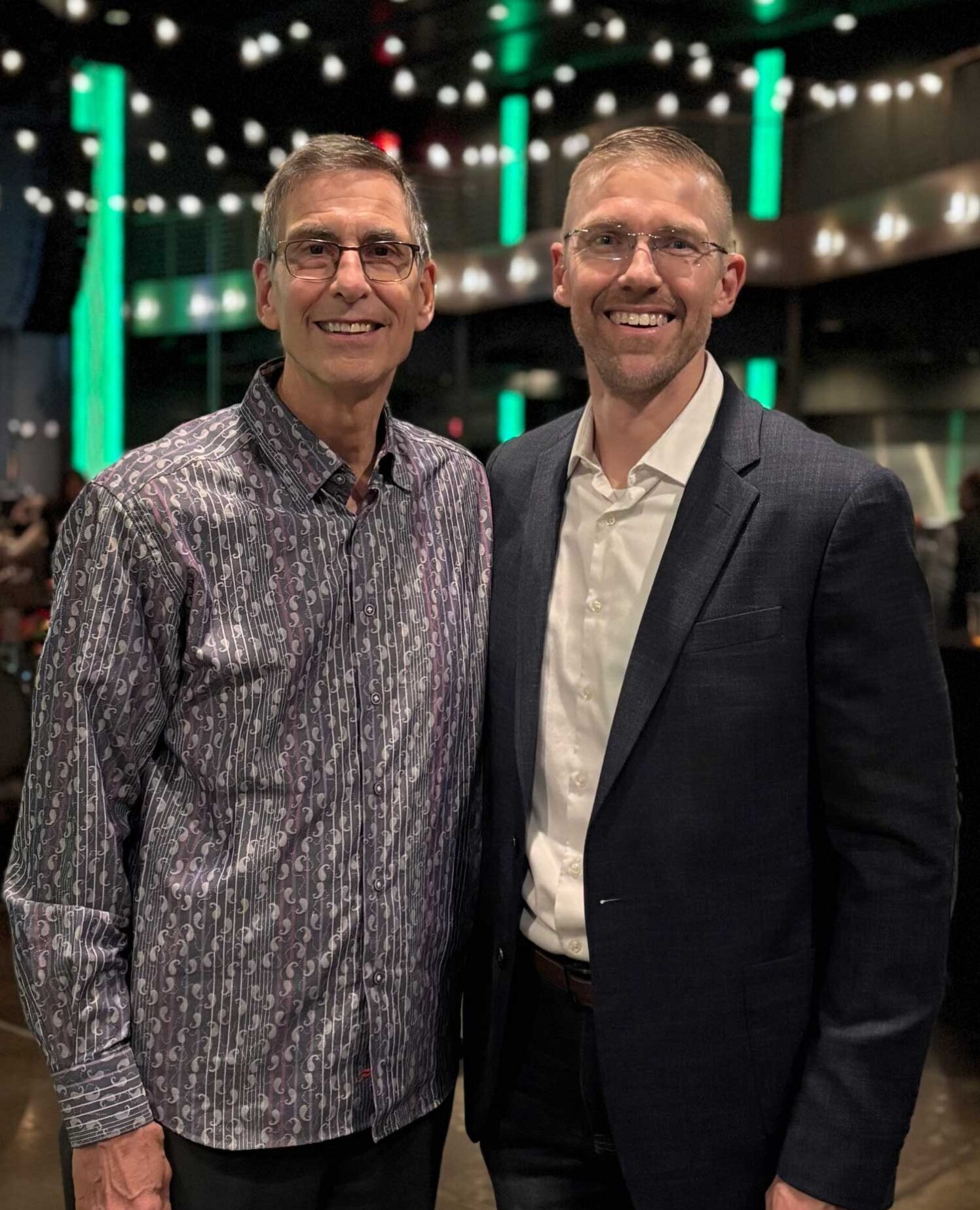 Dave DeVries with his father at a speaking event